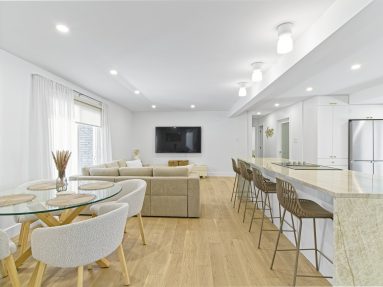 Ottawa-Real-Estate-Photography-Video-Brandplayers-4 Bright and airy living room with waterfall kitchen island and hardwood floors in Ottawa captured by Brandplayers Real Estate Photography services.