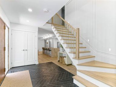 Ottawa-Real-Estate-Photography-Video-Brandplayers-5 Foyer with staircase to second level and open concept leading into bright kitchen in Ottawa captured by Brandplayers Real Estate Photography services.